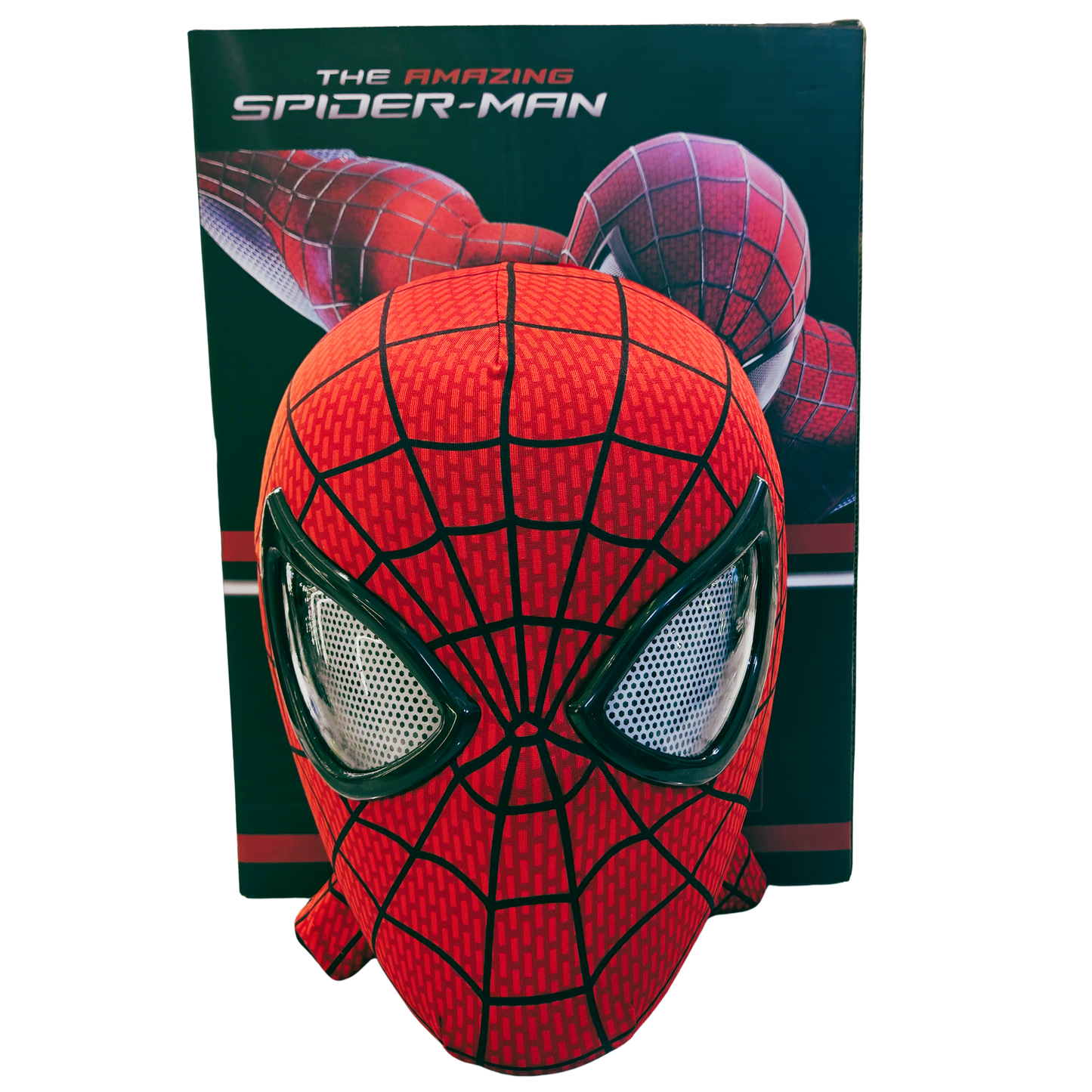 A red and black Spider-Man mask displayed in front of its retail box, which features 'The Amazing Spider-Man' branding and an illustration of Spider-Man.
